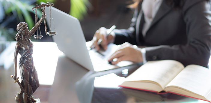 Woman working on laptop in law office for “Is Your Office an Asset or an Expense?”