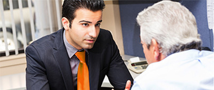 two men talking in meeting