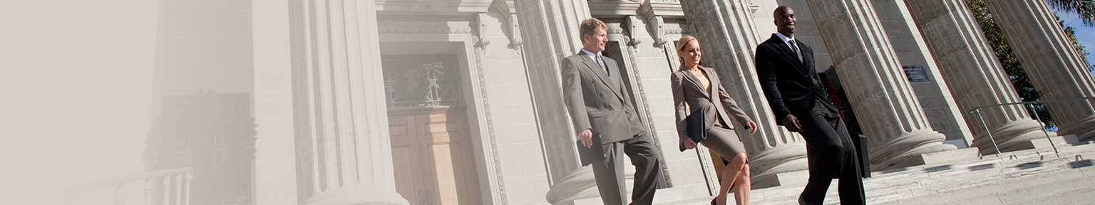 Business men and women walking down the courthouse steps
