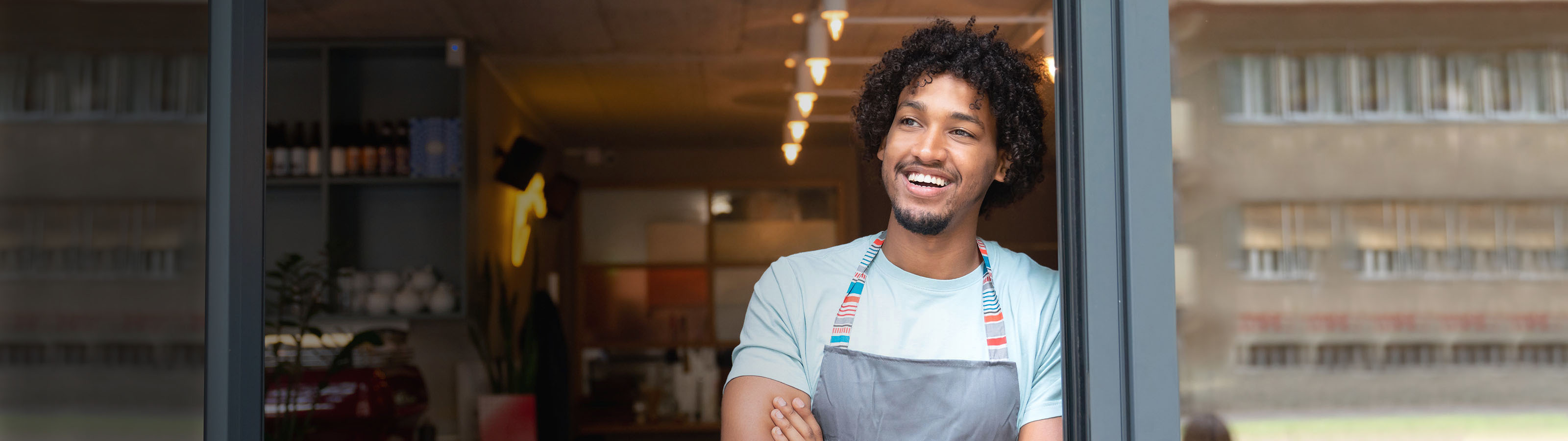 man store front smiling